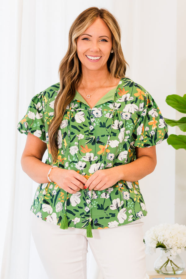 Chic Soul plus size clothing, short sleeve green top with white and yellow floral details with tassels on the collar 