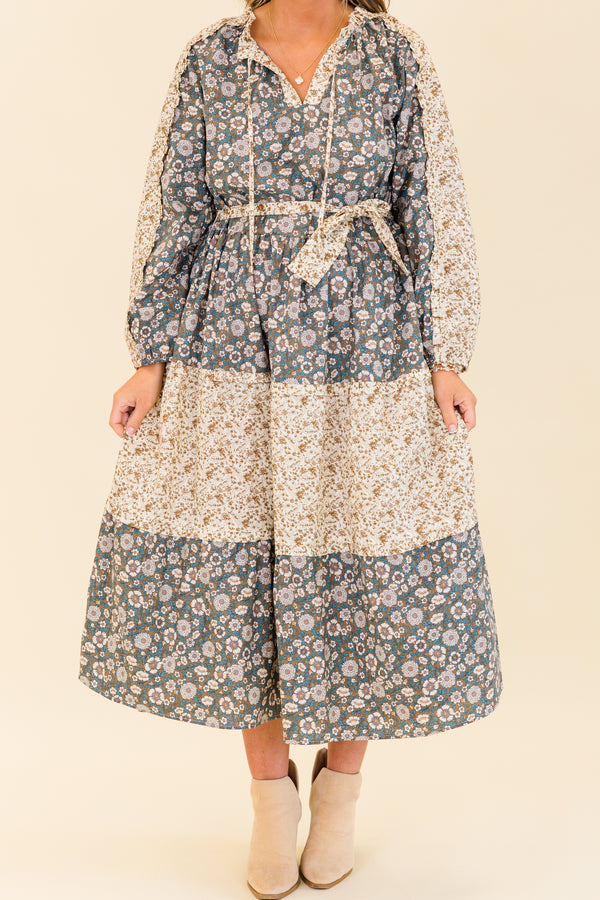 Chic Soul plus size clothing, long-sleeve olive multi-colored maxi dress with v-neckline and tassels with waist-tie and subtle ruffles with different floral patchwork along the dress