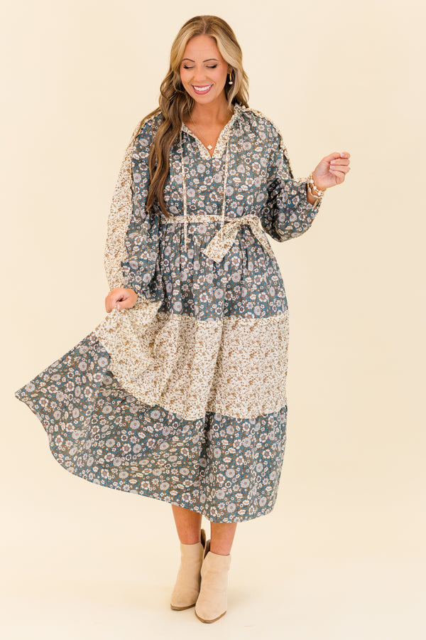 Chic Soul plus size clothing, long-sleeve olive multi-colored maxi dress with v-neckline and tassels with waist-tie and subtle ruffles with different floral patchwork along the dress
