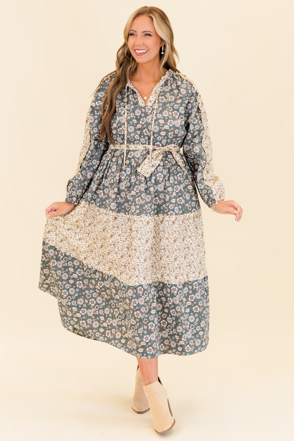 Chic Soul plus size clothing, long-sleeve olive multi-colored maxi dress with v-neckline and tassels with waist-tie and subtle ruffles with different floral patchwork along the dress