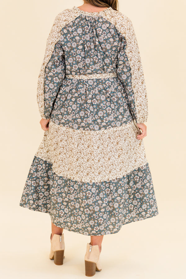 Chic Soul plus size clothing, long-sleeve olive multi-colored maxi dress with v-neckline and tassels with waist-tie and subtle ruffles with different floral patchwork along the dress