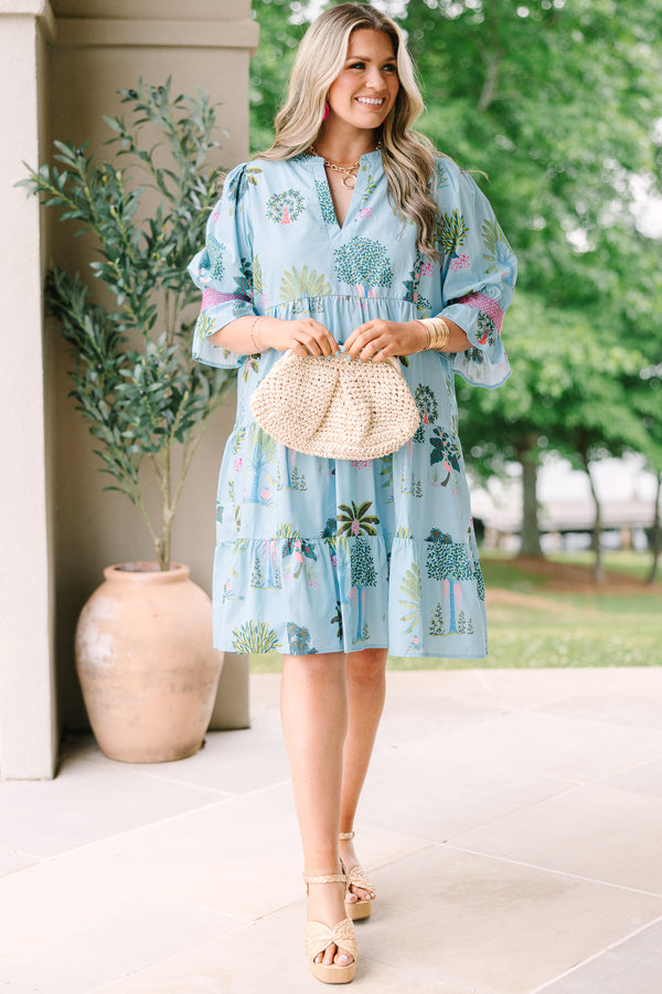 Plus Size seafoam tiered dress with a tropical tree print, V-neckline, and puff sleeves.