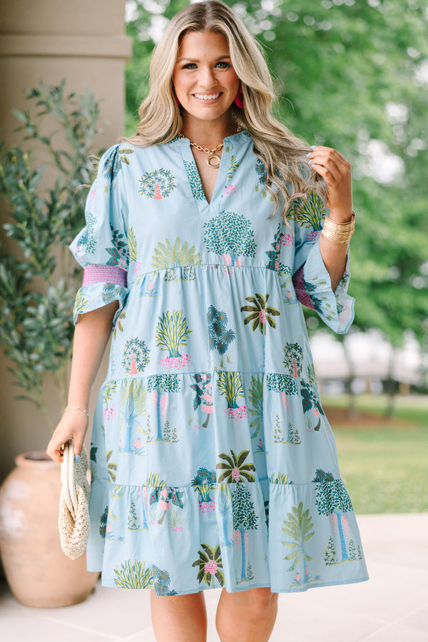Plus Size seafoam tiered dress with a tropical tree print, V-neckline, and puff sleeves.