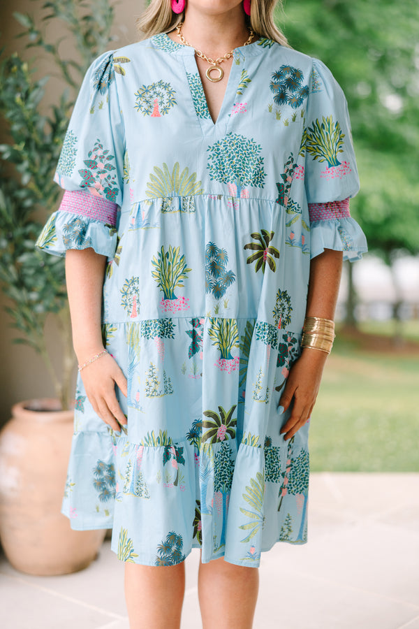 Plus Size seafoam tiered dress with a tropical tree print, V-neckline, and puff sleeves.