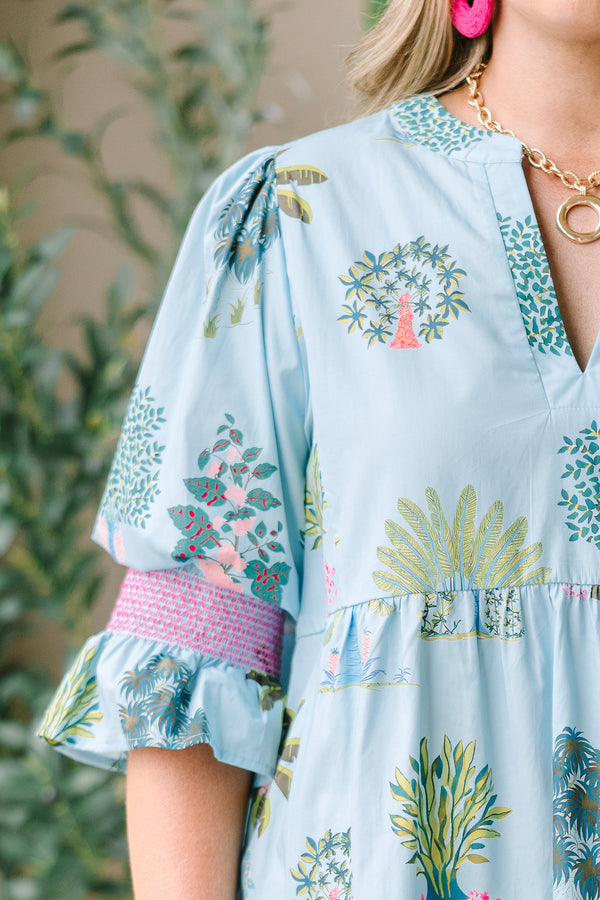 Plus Size seafoam tiered dress with a tropical tree print, V-neckline, and puff sleeves.