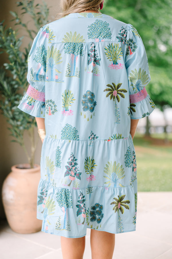 Plus Size seafoam tiered dress with a tropical tree print, V-neckline, and puff sleeves.