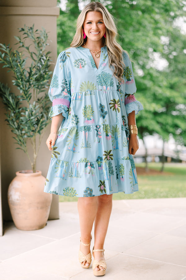 Plus Size seafoam tiered dress with a tropical tree print, V-neckline, and puff sleeves.