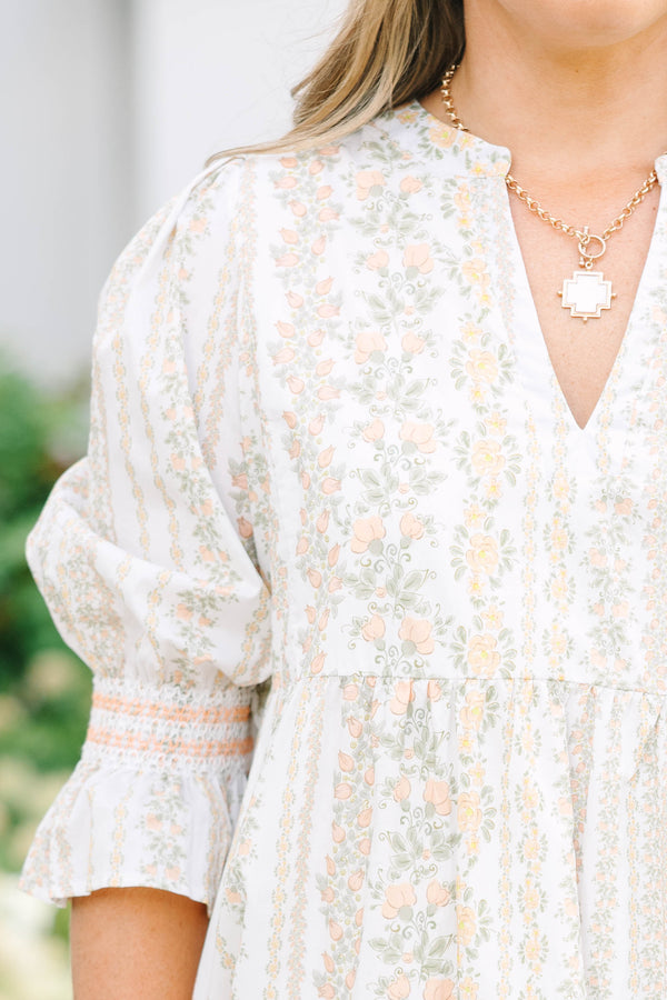 Plus Size cream tiered mini dress with a floral stripe pattern, V-neckline, and puff sleeves.