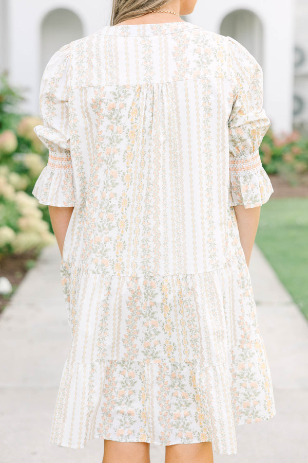 Plus Size cream tiered mini dress with a floral stripe pattern, V-neckline, and puff sleeves.