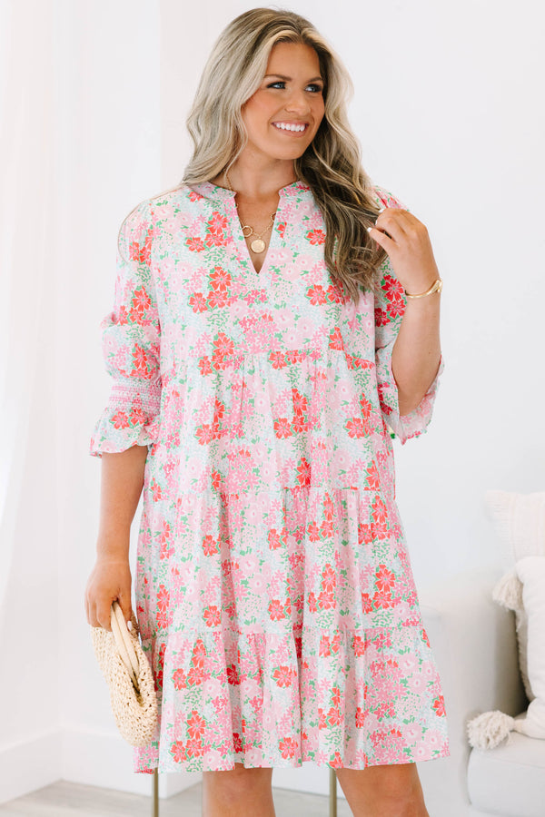 Plus size pink floral tiered dress with a flowy fit and ruffle smocked sleeves.