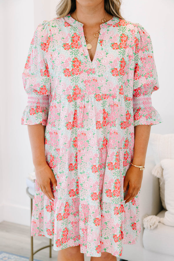 Plus size pink floral tiered dress with a flowy fit and ruffle smocked sleeves.