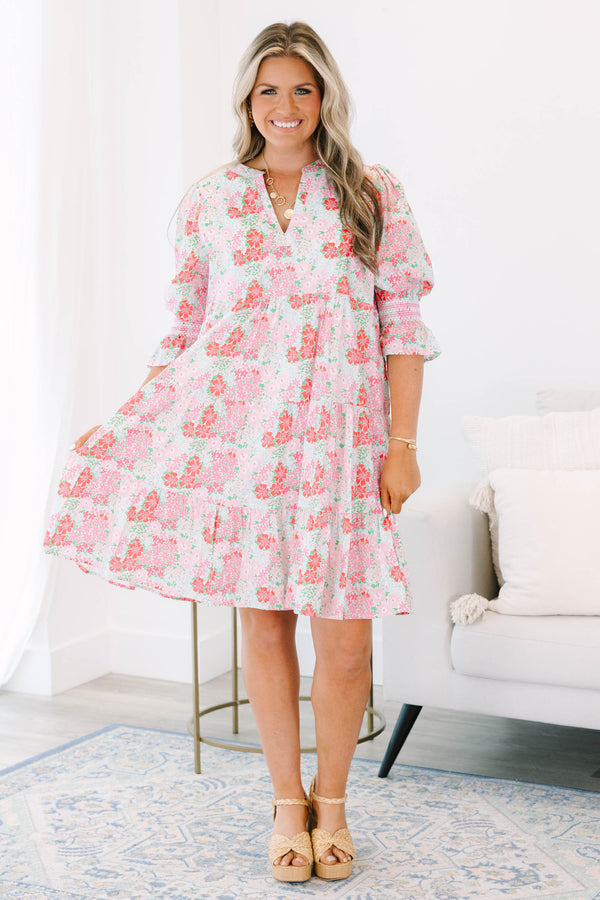 Plus size pink floral tiered dress with a flowy fit and ruffle smocked sleeves.