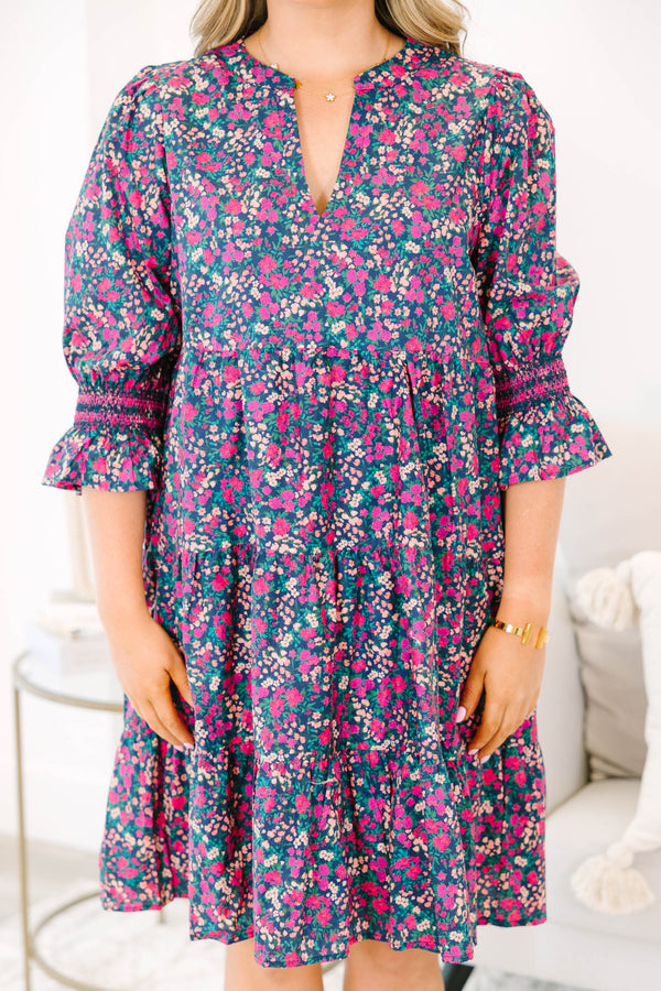 Plus Size tiered mini dress in a pink and navy floral print with a V-neckline and ruffled sleeves.