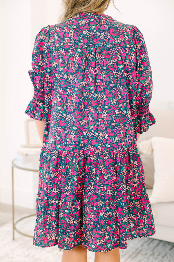 Plus Size tiered mini dress in a pink and navy floral print with a V-neckline and ruffled sleeves.