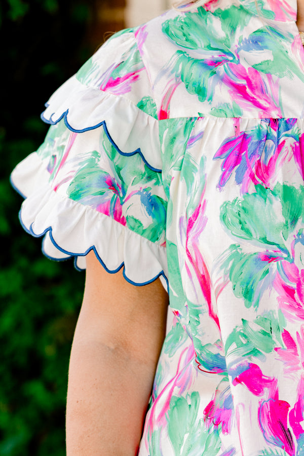 Chic Soul Plus size clothing, green blouse with a abstract flora pattern and flutter sleeves that have white scalloped ruffles on them that are outlined in blue stitching 
