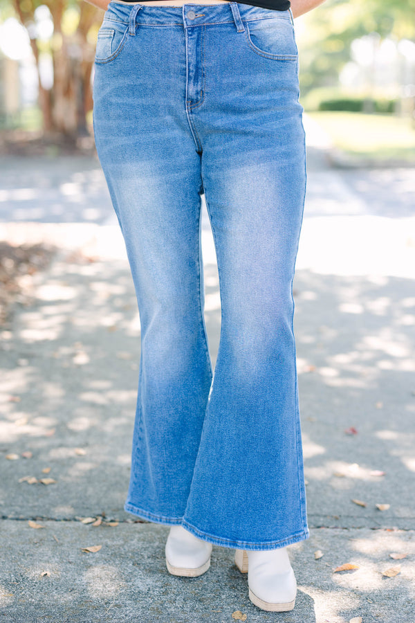 Plus Size medium wash flare jeans with a high-waisted fit and classic five-pocket styling.