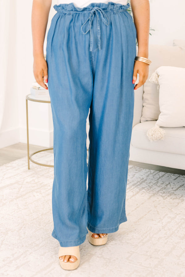 Plus Size medium denim wide-leg pants with a paperbag waist and drawstring tie.