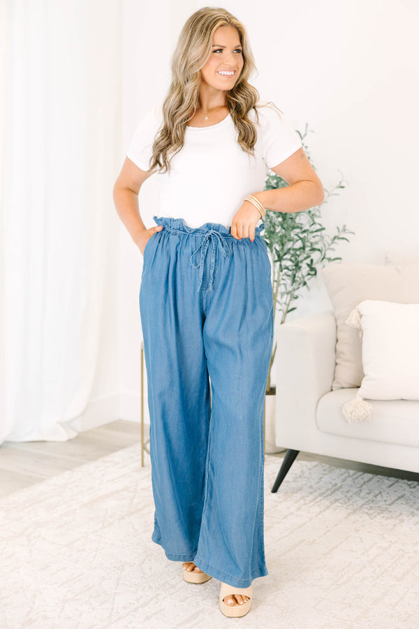 Plus Size medium denim wide-leg pants with a paperbag waist and drawstring tie.