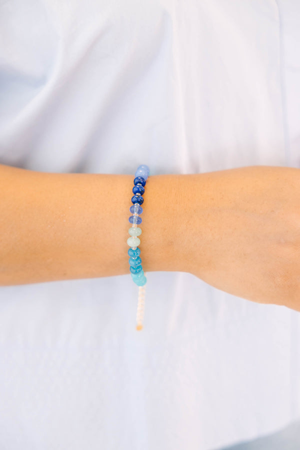 Plus Size Shoreline Shimmer Bracelet with a gradient of blue, teal, and white beads.