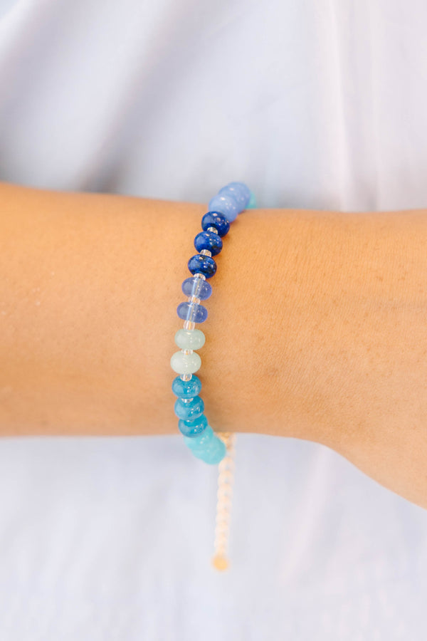 Plus Size Shoreline Shimmer Bracelet with a gradient of blue, teal, and white beads.