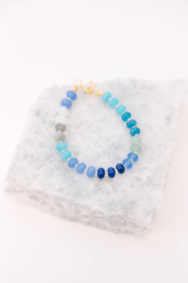 Plus Size Shoreline Shimmer Bracelet with a gradient of blue, teal, and white beads.