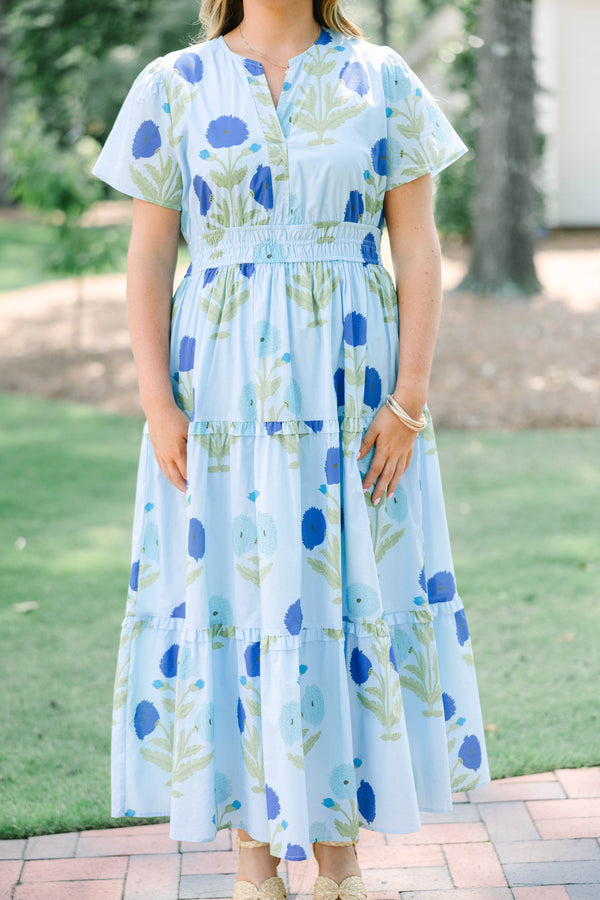 Plus Size light blue floral tiered maxi dress with short sleeves and a v-neckline.