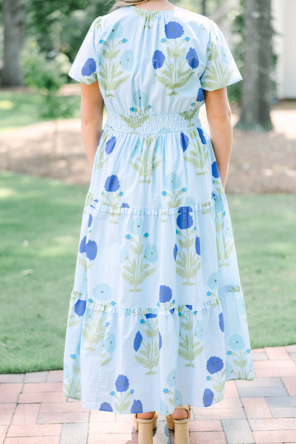 Plus Size light blue floral tiered maxi dress with short sleeves and a v-neckline.