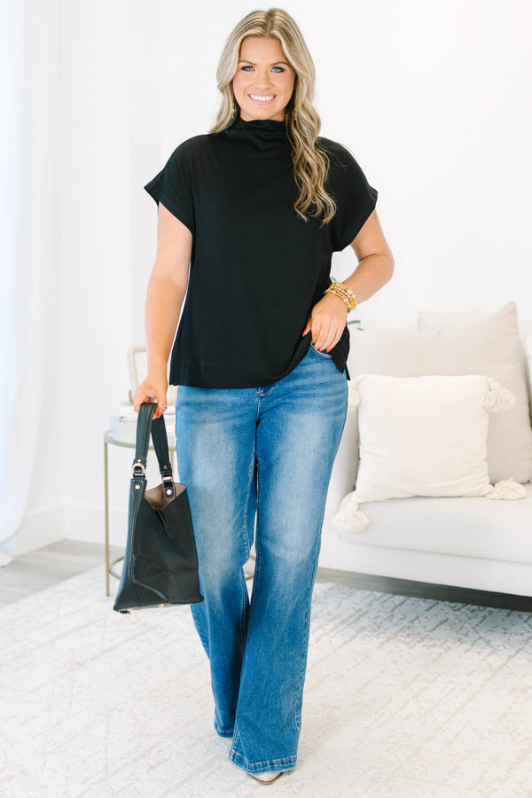 Plus Size black short sleeve mock neck top with a relaxed fit and side slits.