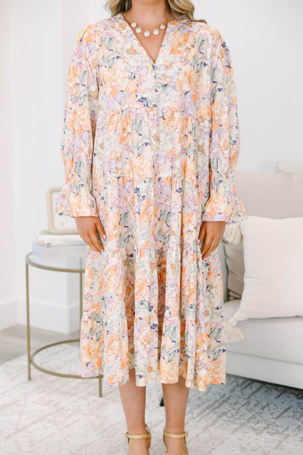 Plus Size tiered midi dress in a multi-color floral cotton fabric with long smocked cuff sleeves.