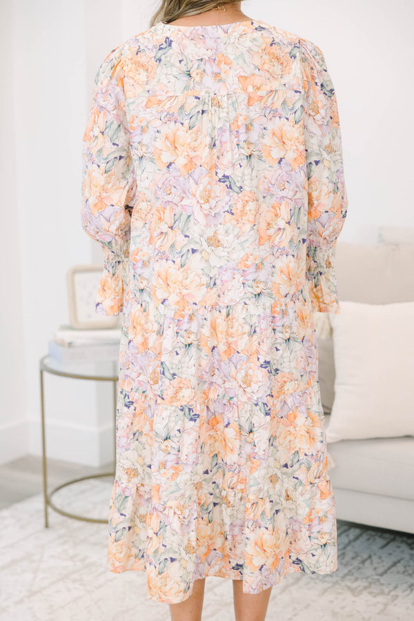Plus Size tiered midi dress in a multi-color floral cotton fabric with long smocked cuff sleeves.