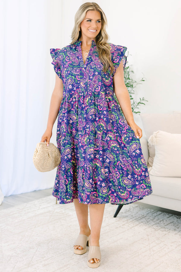 Navy floral tiered midi dress with ruffled cap sleeves and a v-neckline.