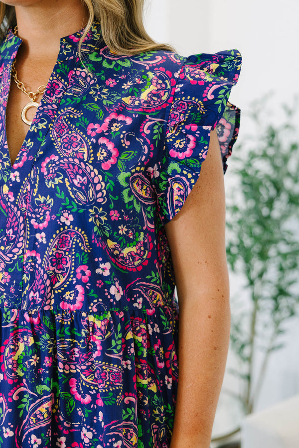 Navy floral tiered midi dress with ruffled cap sleeves and a v-neckline.