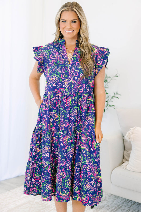 Navy floral tiered midi dress with ruffled cap sleeves and a v-neckline.