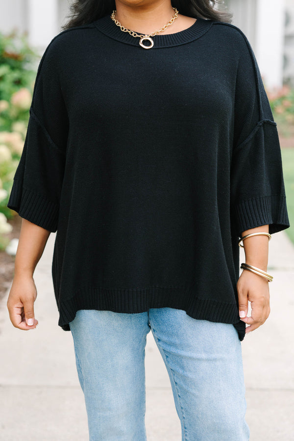 Plus Size black v-neck sweater with three-quarter sleeves and a relaxed fit in a knit fabric.
