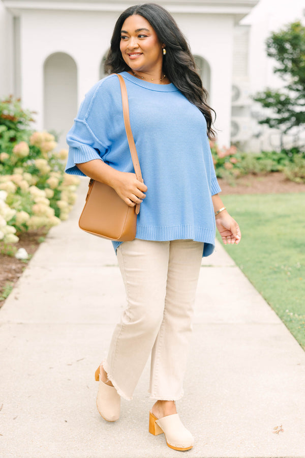 Plus size blue sweater, featuring a flowy fit and soft knit texture.