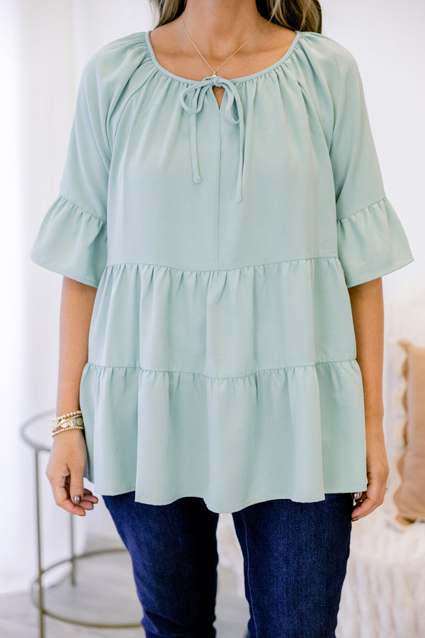 Chic Soul plus size clothing, short-sleeve ruffled dusty sage green baby doll top with a subtle v-neckline and tie on the neckline