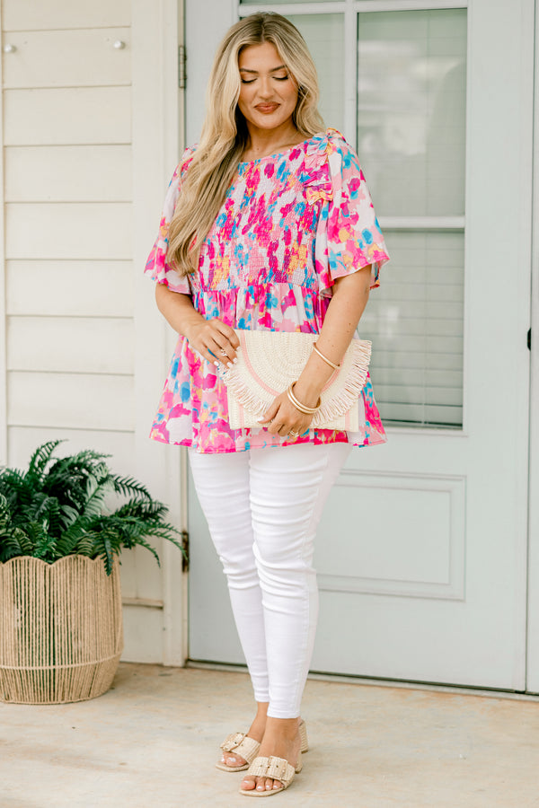 Chic Soul plus size clothing, light pink  short-flutter sleeve rounded neckline babydoll top with abstract warm magenta and cerulean pattern plus a ruched bodice and ruffles on the shoulders