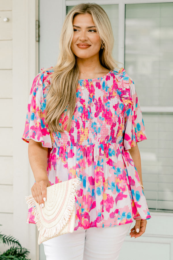 Chic Soul plus size clothing, light pink  short-flutter sleeve rounded neckline babydoll top with abstract warm magenta and cerulean pattern plus a ruched bodice and ruffles on the shoulders