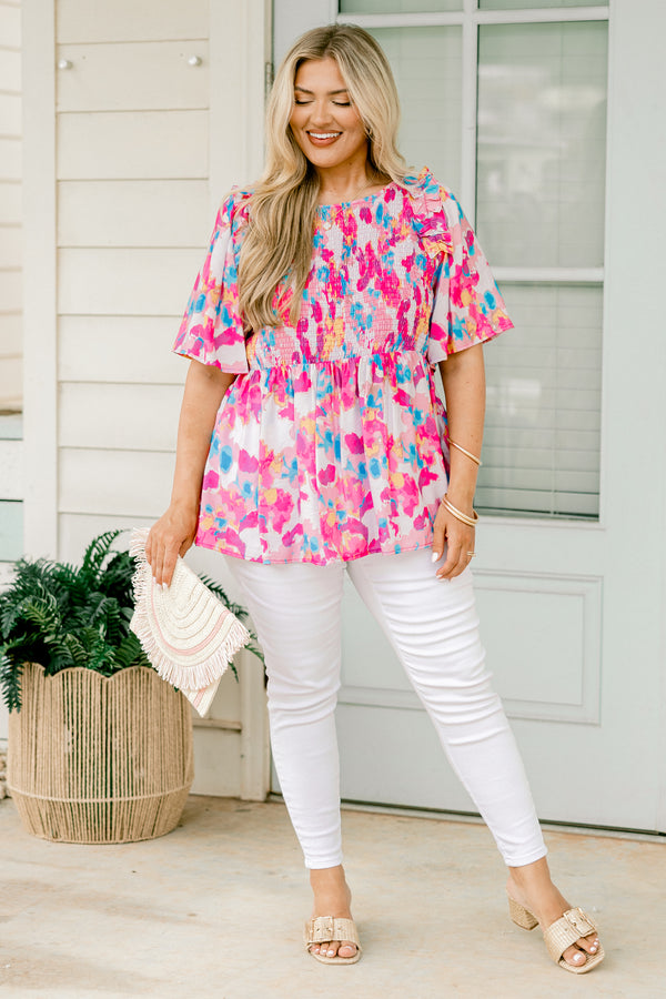 Chic Soul plus size clothing, light pink  short-flutter sleeve rounded neckline babydoll top with abstract warm magenta and cerulean pattern plus a ruched bodice and ruffles on the shoulders