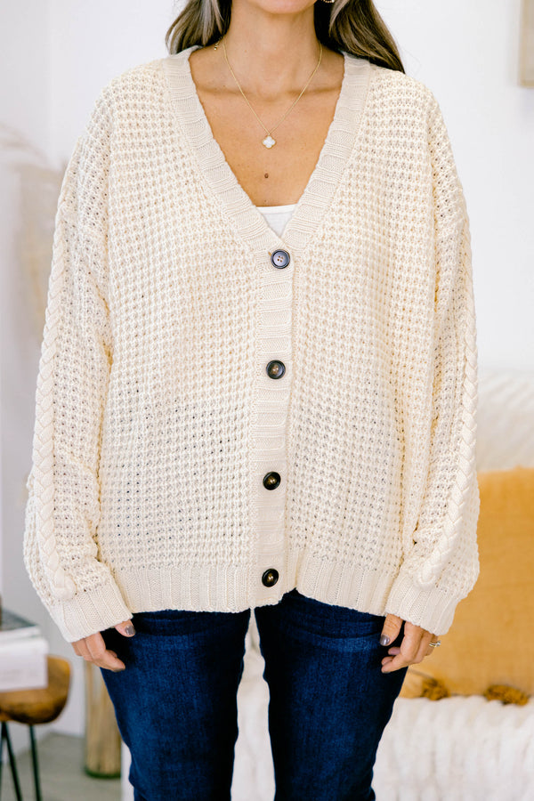 Chic Soul plus size clothing, white woven cardigan with buttons going down the center of the shirt and a slight v-neckline 