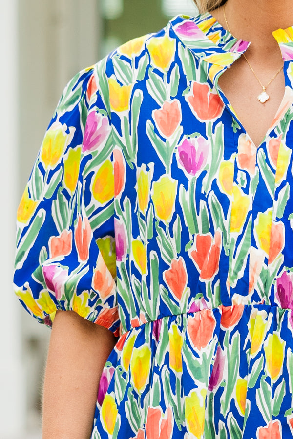 Chic Soul plus size clothing, blue short sleeve tiered mini dress with orange/yellow/pink floral tulip print with v cutout along neckline with puff sleeves
