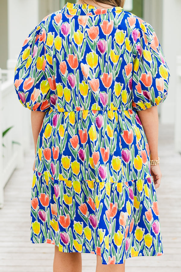 Chic Soul plus size clothing, blue short sleeve tiered mini dress with orange/yellow/pink floral tulip print with v cutout along neckline with puff sleeves