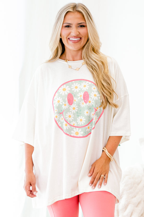 Chic Soul plus size clothing, ivory graphic tee with a pink smiley face on the center of the shirt that is filled with a blue daisy pattern 