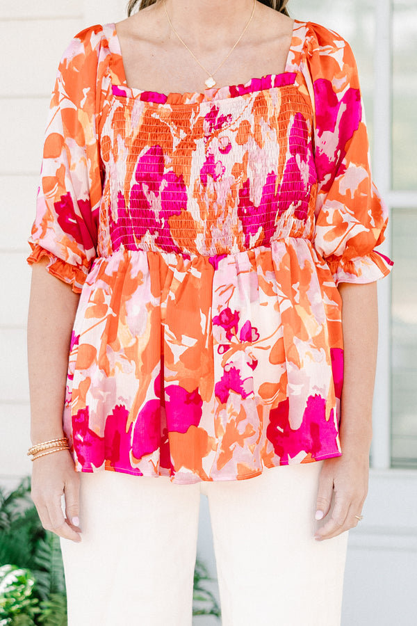 Chic Soul plus size clothing, pink/orange multi floral print peplum top with smocked chest detail with square neckline and puff sleeves with ruffle detail
