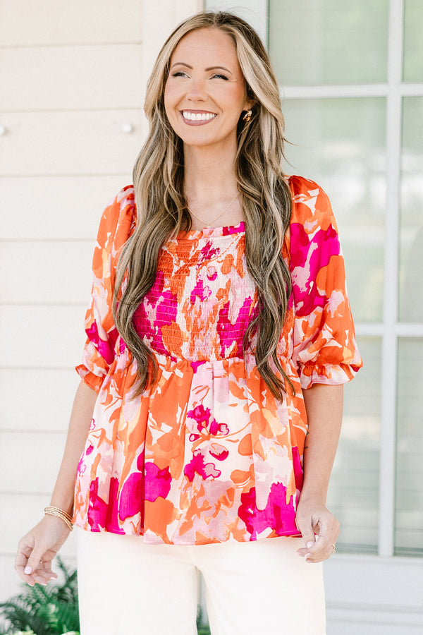 Chic Soul plus size clothing, pink/orange multi floral print peplum top with smocked chest detail with square neckline and puff sleeves with ruffle detail