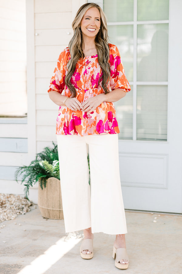 Chic Soul plus size clothing, pink/orange multi floral print peplum top with smocked chest detail with square neckline and puff sleeves with ruffle detail