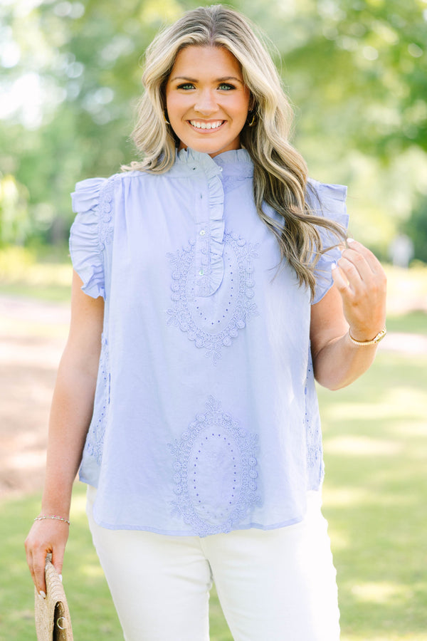 Plus Size light blue sleeveless top with ruffle trim, high neck, and intricate floral embroidery.