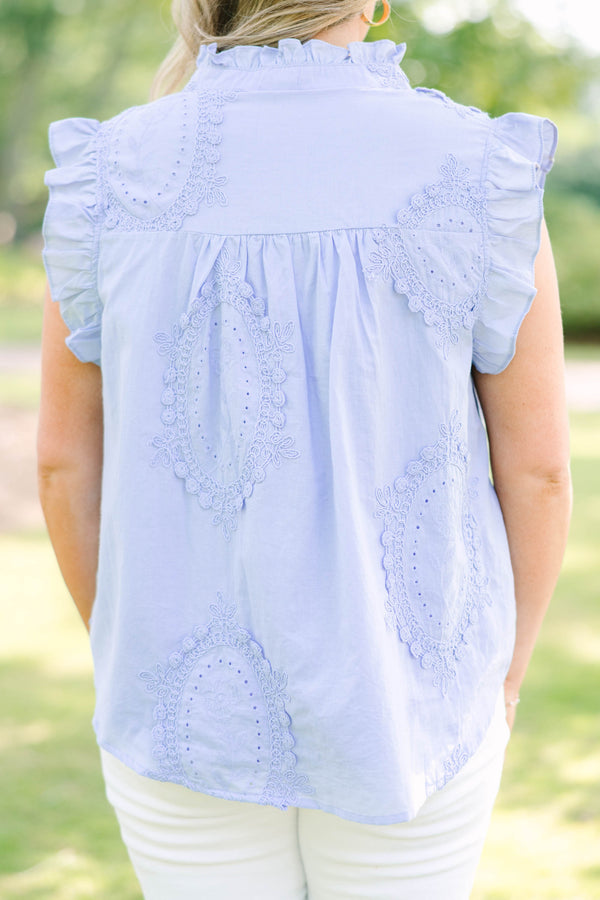 Plus Size light blue sleeveless top with ruffle trim, high neck, and intricate floral embroidery.