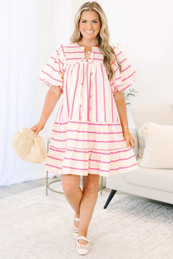 Plus Size pink and cream striped mini dress with puff sleeves, smocked yoke, and tiered skirt.