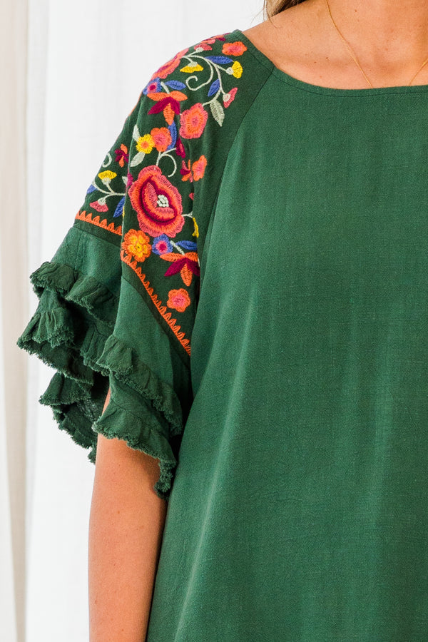 Chic Soul plus size clothing, short sleeve forest green top with ruffled bottom and sleeves with pink floral details on the sleeves